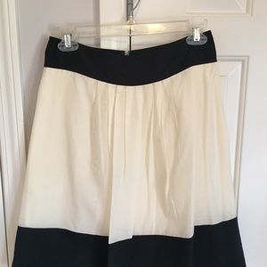 A-line cream skirt with black band